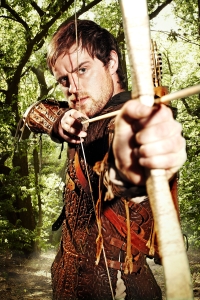 Jonas Armstrong takes aim at the bad guys as Robin Hood. Photo copyright of Tiger Aspect Productions and the BBC